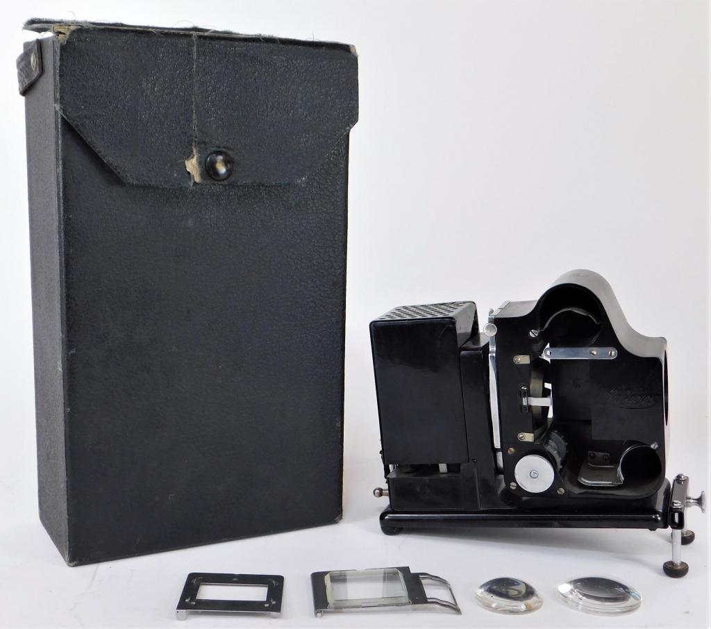 Leica Miniature Film Projector: Leica Miniature film projector with original box. Two lenses, missing turret. Cut plug.