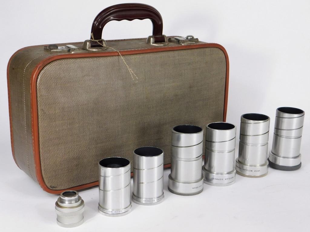 Lot of 7 Leitz Projector Lenses in Case: Lot of 7 Leitz projector lenses in case. Includes 65mm f/1.4. (2) Elmaron 50mm f/2.8, Hektor 85mm f/2.5, Kektor 100mm f/2.5, and (2) Dimaron 100mm f/2.8 lenses.