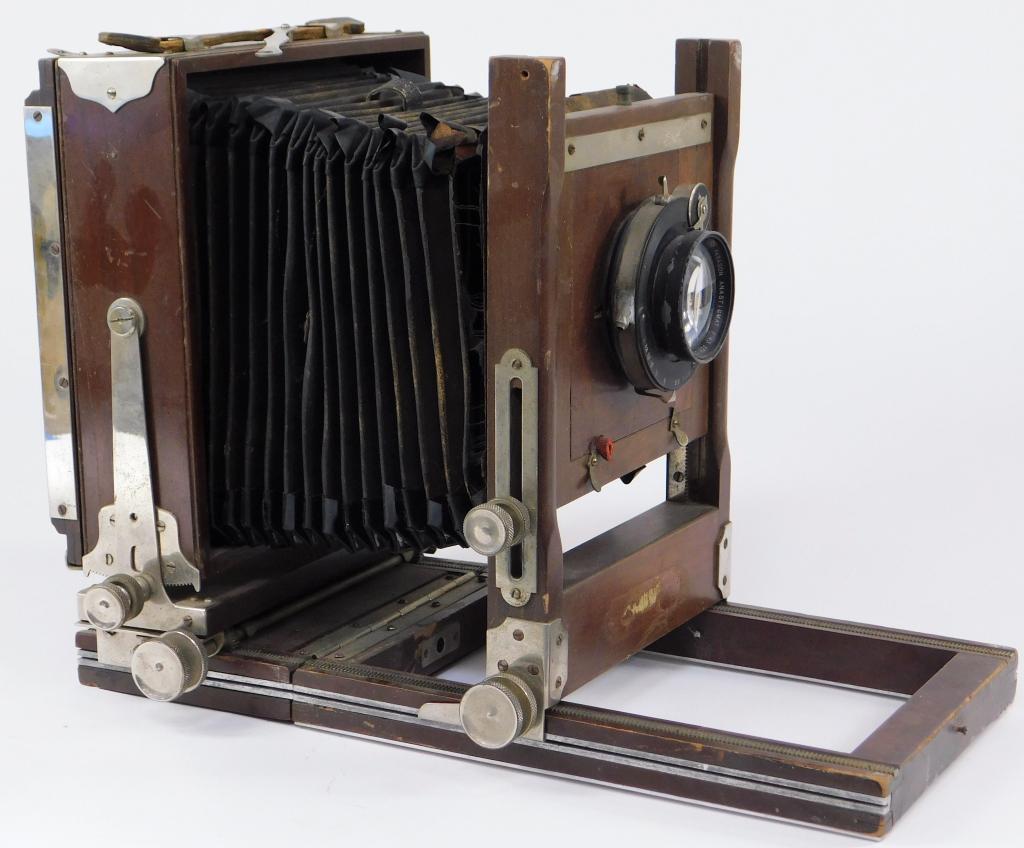 Gundlach Korona View 5x7 Camera: Gundlach Korona 5x7 view camera. Ilex Paragon Anastigmat 7-1/2 inch f/4.5 Series A with Universal shutter. Missing rail bolt and ground glass. Blown bellows.