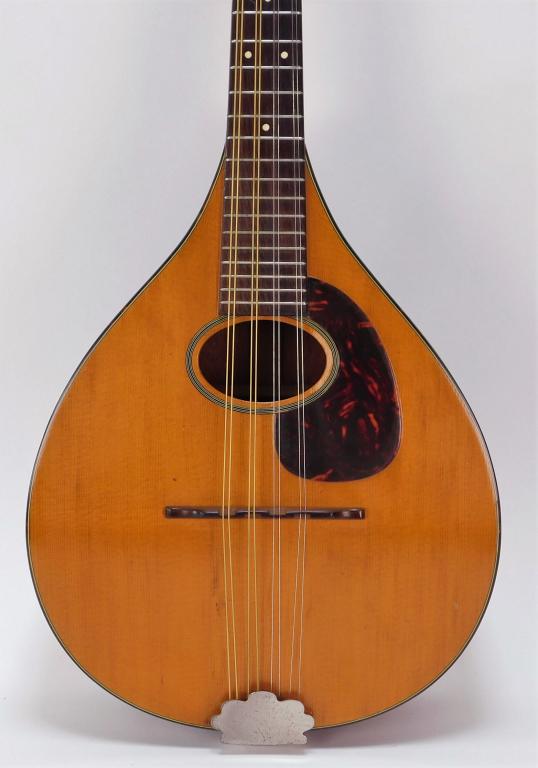 C.F. Martin A Style Oval Hole Mandolin Instrument: ,United States,Early 20th Century Spruce top with rosewood fretboard and mahogany back with inlaid stringing to the edges. Eight string with original carry case. Overall 23 3/4", Signed inside with br
