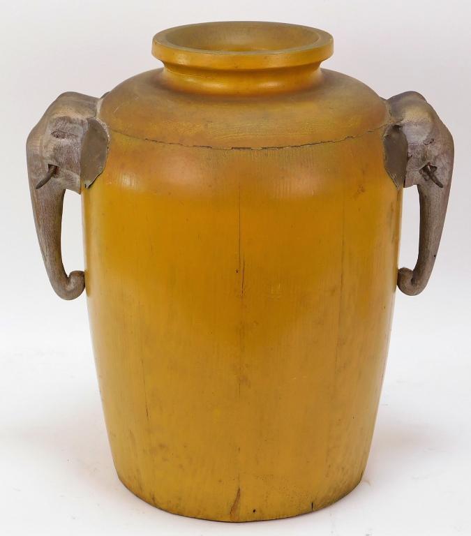 Japanese Meiji Period Carved Wood Elephant Vase: ,Japan,Meiji period Sturdy heavy wall with mustard yellow paint with a pair of elephant carved wood handles in a silvered tone. 14",