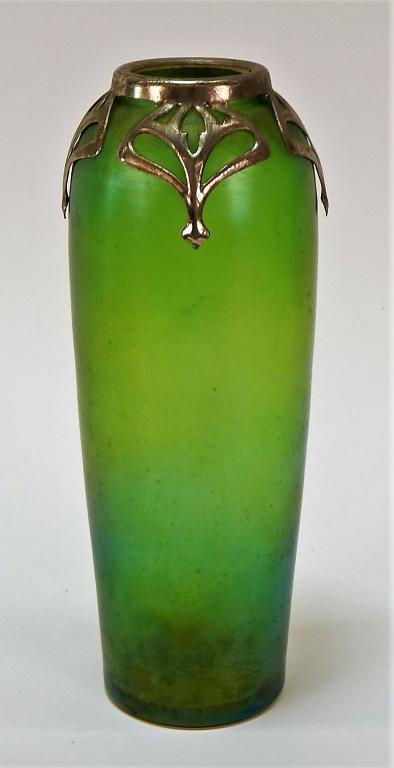 Czech Art Nouveau Silver Overlay Iridescent Vase: ,Czeckoslovakia,C.1920 A buff iridescent green art glass with metal with silver plated overlay caging the neck. 8 1/4" tall, Unmarked Unmarked