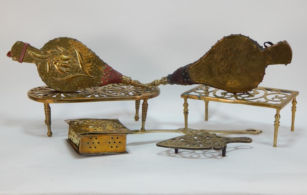 6PC 19C. Brass Trivet Bellows Hearth Fireplace Lot: ,United States,19th Century Includes an oval shaped trivet with flower patterned grate, a spade shaped trivet with knot patterned grate, a rectangular trivet with tendril patterned grate, two bellows