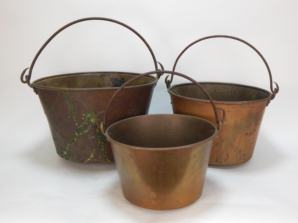 3PC Brass Rat Tail Bale Handle Nesting Pails: ,Europe,19th Century Includes three pails of varying sized with tapered bodies and thin handles. Smallest 13" x 10 5/8" dia.,Largest 17 1/2" x 14 1/4" dia.,Brass From the collection of a Westerly, Rho