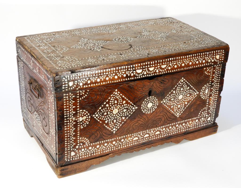 Anglo Indian MOP Inlay Wood Chest: ,India,20th Century Rectangular chest opening to one compartment carved with acanthus leaf details and inlaid with elaborate geometrical mother of pearl designs over lid and body. 13 1/8" t x 22 1/2" 