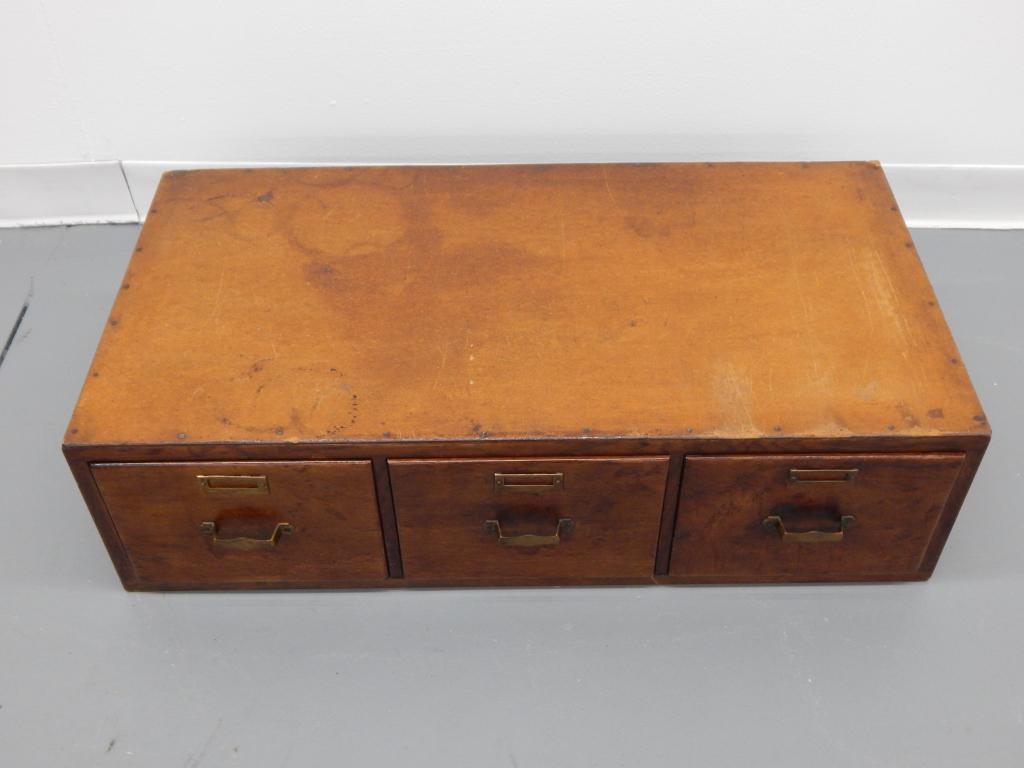 American Oak Leather Top 3 Drawer File Cabinet: ,United States,Early 20th Century Horizontal three drawer file cabinet with Masonite added top working surface. Fits 9" x 6" cards.33" x 17" x 9",,OakFrom the collection of an East Greenwich, Rhode Is