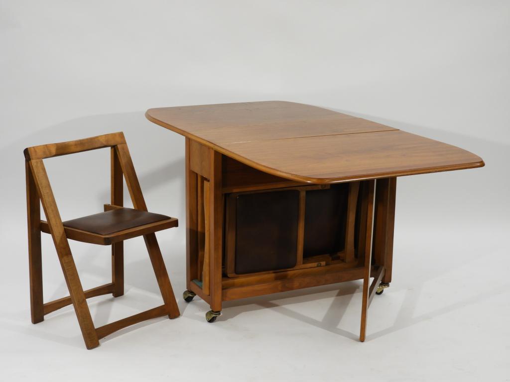 C.1960 American MCM Modern Nesting Dinette Set: ,United States,Circa 1960 Oval drop leaf table over one drawer with four nesting chairs.34" x 12" x 29" tall,Each leaf 25 1/2",WalnutFrom the collection of a Cranston, Rhode Island gentleman.