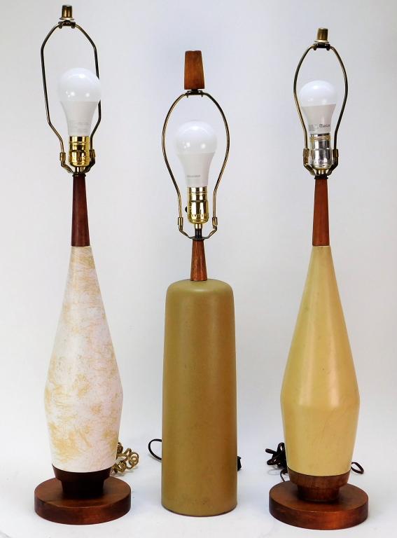 3PC MCM Modern Martz Marshall Studio Lamp Group: ,United States,Circa 1960 Group includes a Gordon and Jane Martz cylindrical earthenware lamp with matching teak neck and finial and a near pair of American Modern earthenware lamps on a circular wood