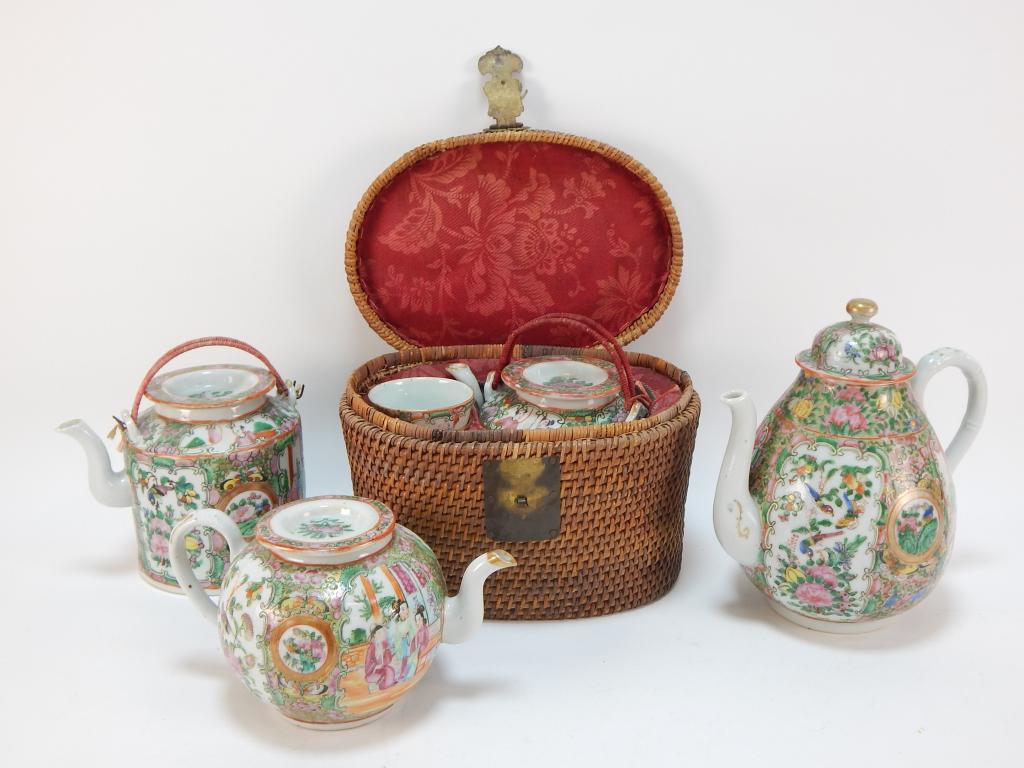 4PC Chinese Rose Medallion Porcelain Teapot Group: ,China,19th Century Includes a small, medium, and large teapot of varying shapes and a tea set comprised of two teacups and a teapot in a wicker basket decorated with garden and court scene cartouches