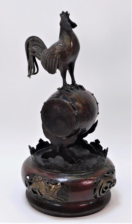 21" Japanese Bronze Rooster on Barrel Okimono: ,Japan,Meiji Period A large Okimono of a Rooster seated atop a barrel mounted to the bottom of a censer. 21" tall x 10" diameter,,Bronze From the estate of a Medfield, Massachusetts gentleman.