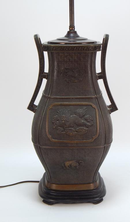 Large Japanese Bronze Archaic Style Vessel Lamp: ,Japan,Meiji period Archaic Chinese Hu form style bronze vessel with Phoenix bird and Qilin amongst other zodiac animals, with high swooping handles on a carved wooden base. Will take 12+" shade. Bron