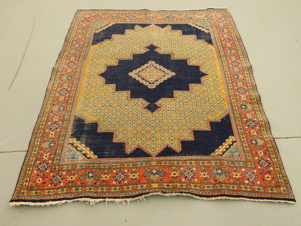 Antique Northwest Persian Open Field Carpet Rug: ,Persia,Early 20th Century Navy blue field with yellow diamond pattern with intricate floral repeated design surrounded by a stylized floral border on salmon ground. Appears to be signed in each corne