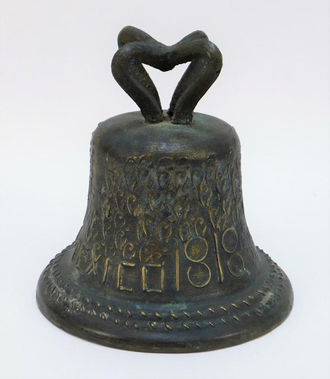 19C Mexican Bronze Missionary Bell: Mexico 19th Century Sturdy bell with original clacker, decorated with curled tendril patterns across the body and the image of the Virgin Mary beside the inscription "Mexico 1818." 8 1/2" x 8 1/2",,Br