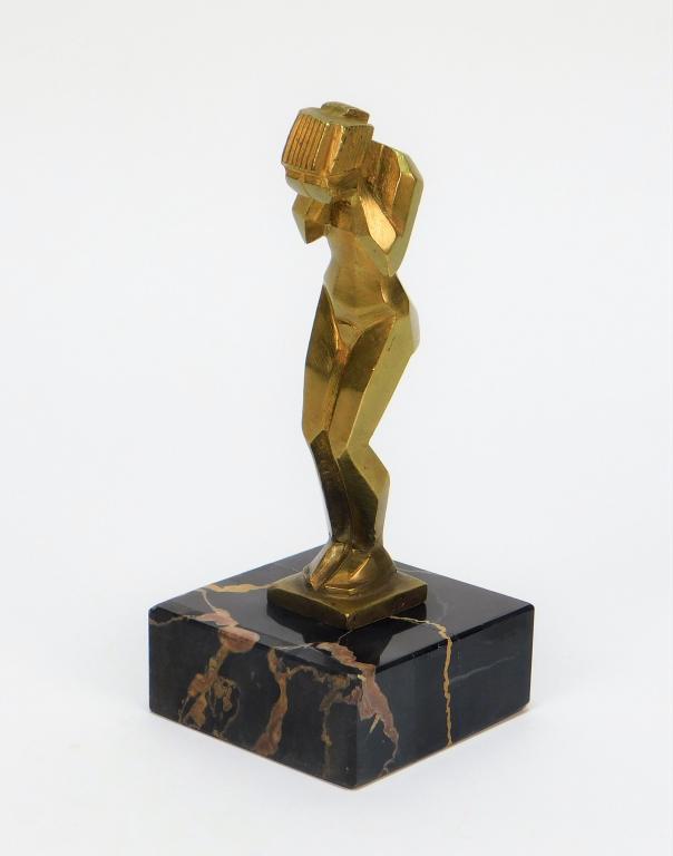 SM French Gilded Bronze Art Deco Nude Woman Statue: France Early 20th Century Depicts an angular cubist woman standing with her face in her hands. Statue 4" t x 7/8" w x 7/8" d,Base 7/8" t x 2 1/8" w x 2 1/8" d,Brass, marble One edge of base marked "Ma