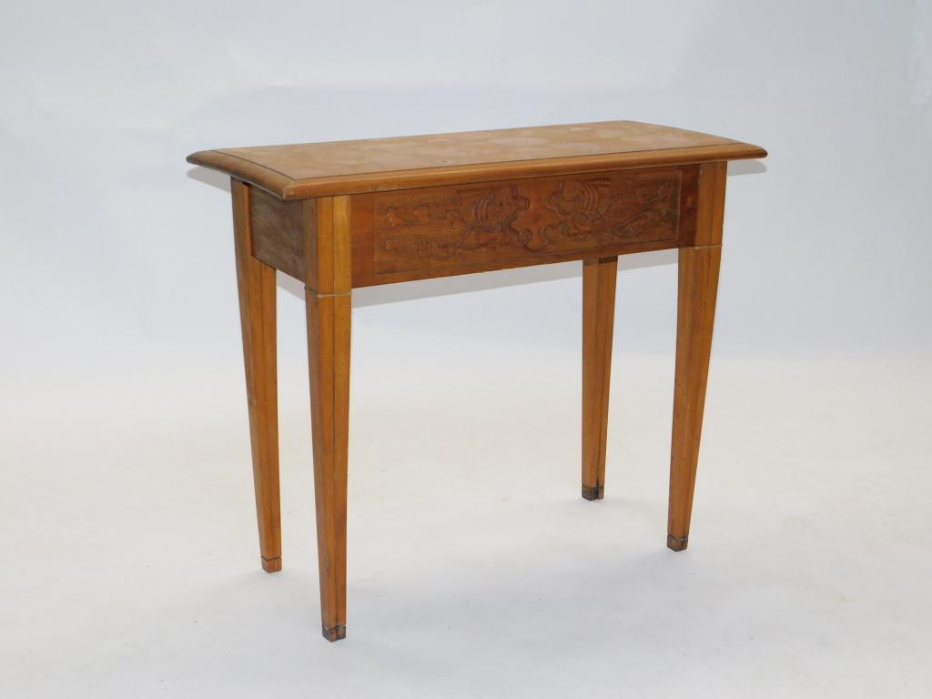 Frank Moran Botanical Carved Wood Console Table: United States 20th Century Rectangular top inlaid with floral designs over grape vine carved apron supported by four two piece wire construction tapered legs. Frank Moran was a well known Vermont folk
