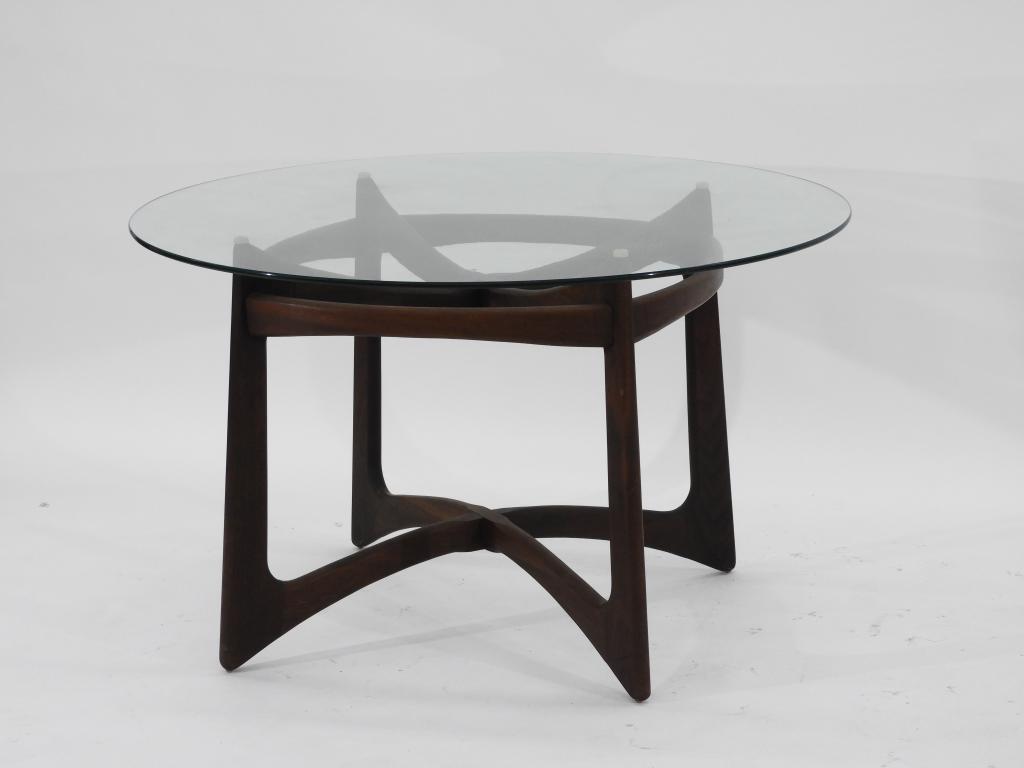 Adrian Pearsall Compass Glass Dining Table: New York, Pennsylvania 1925-2011 Circular glass top supported by lap-jointed compass form base. 30" x 48" dia.,,Walnut and glass ,From the collection of an Uxbridge, MA gentleman.