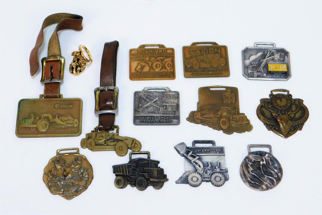 13PC American Heavy Machinery Watch Fob Group: United States Early 20th Century Includes a Perkins Machine Co. Inc. badge, a Clark Equipment Company badge, a Link-Belt Speeder Shovel Crane badge, a P & H Harnischfeger Corporation badge, a Galion b