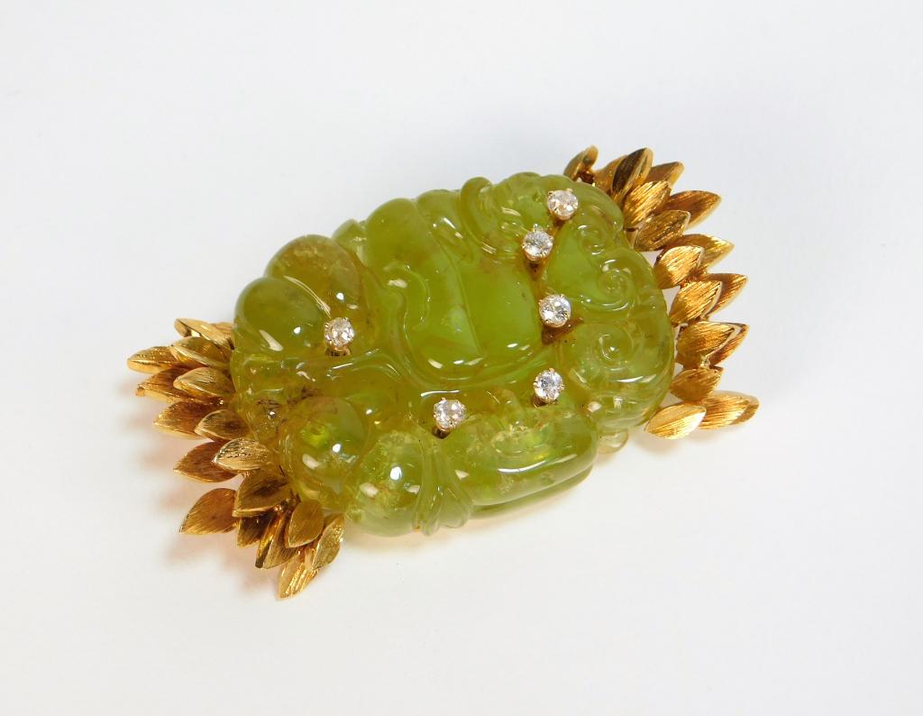 David Webb 18K Gold Carved Citrine Pendant: David Webb New York 20th Century Large carved citrine with Asiatic inspired design inset with six diamonds encased in 18K gold with leaf textured frame. Weight as seen 65.1 grams. 2 1/2" x 1 3/8",,18K