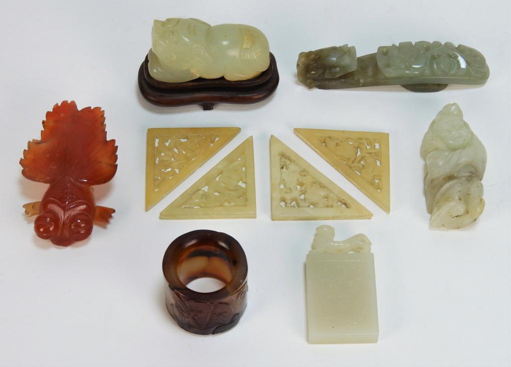 10PC Chinese Carved Figural Hardstone Statues: China Qing Dynasty Includes four flower carved triangular medallions, a lounging foo dog, an agate goldfish, a foo beast tablet, large bead decorated with a scholar and bat, a botanical dragon belt ho