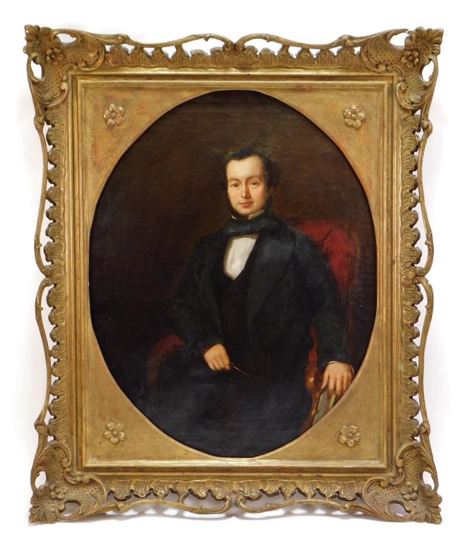 English School Portrait of a Gentleman Painting: ,England,Mid 19th Century Depicts a gentleman in a black suit with large navy necktie seated on a red tufted chair holding a pen and book. Oil on canvas,Canvas 23 3/8" x 18 3/8",Frame 29" x 24" Canvas