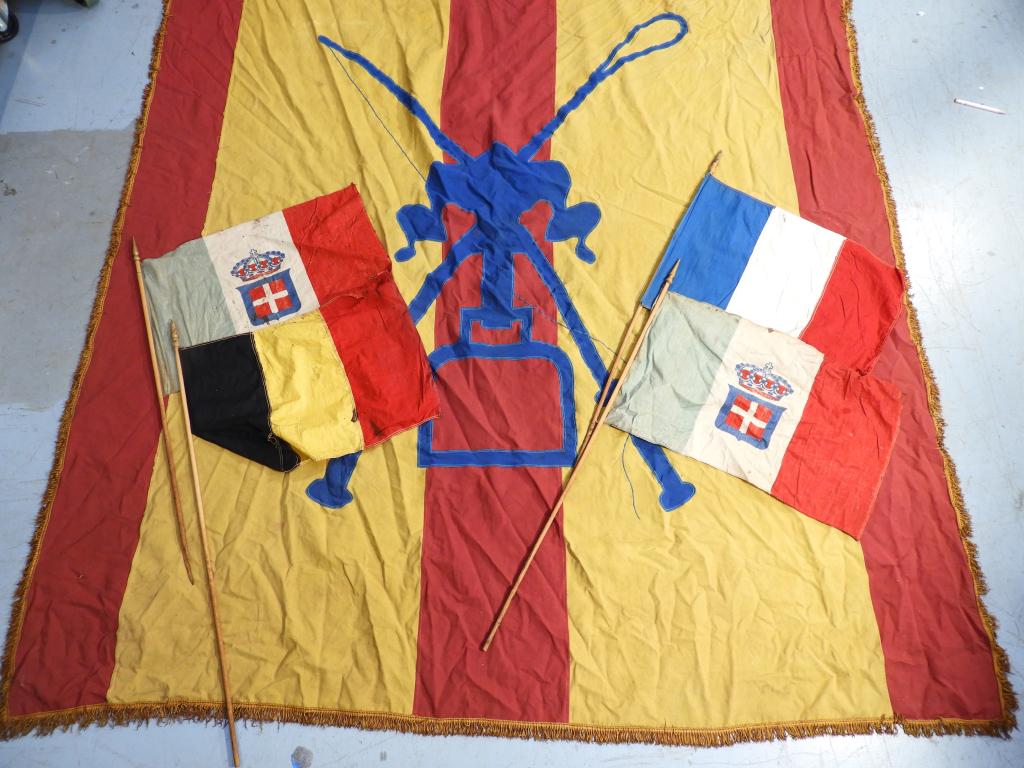 C.1900 European Family Crest Banner Flag: ,Europe,Early 20th Century A large banner made of heavy cloth with machine stitching and fringe. Depicting a family crest with gun and riding crop, included are four smaller flags from European countr