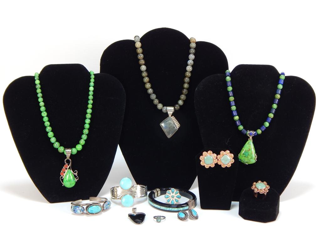 12PC Native American Style Jewelry Group: ,United States, Mexico,20th Century Includes three bangle bracelets, two green turquoise necklaces, a pair of flower shaped turquoise earrings with matching size 6 ring, oval shaped turquoise studs, a