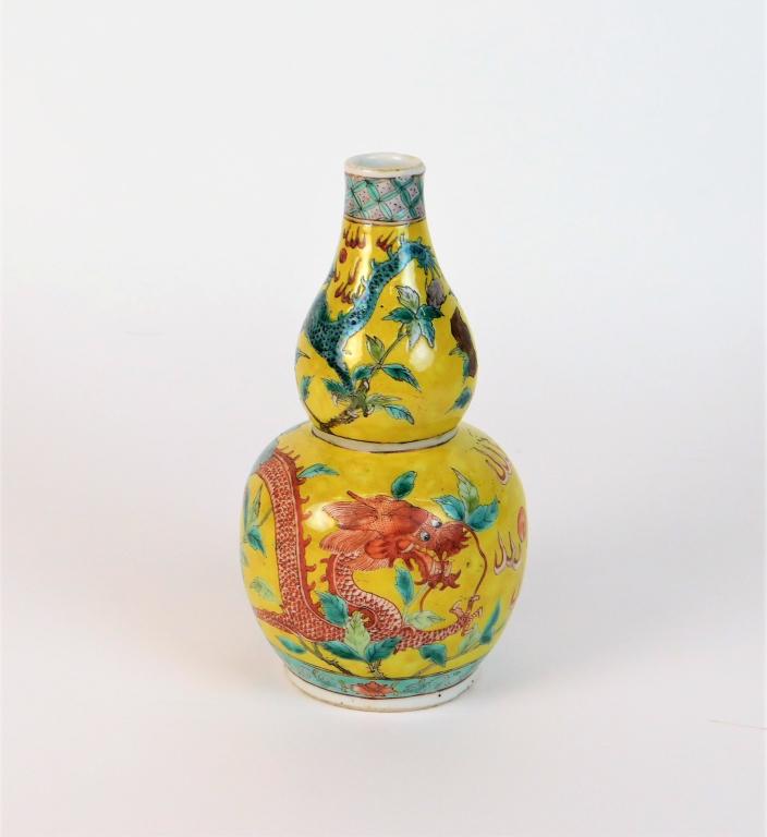 Chinese Qing Dynasty Famille Jaune Dragon Vase: ,China,Qing Dynasty Double gourd vase decorated with green and red dragons surrounded by trees over a yellow field. Porcelain,7 1/8" x 3 3/8" dia., No marks. From the collection of an Uxbridge, Massac
