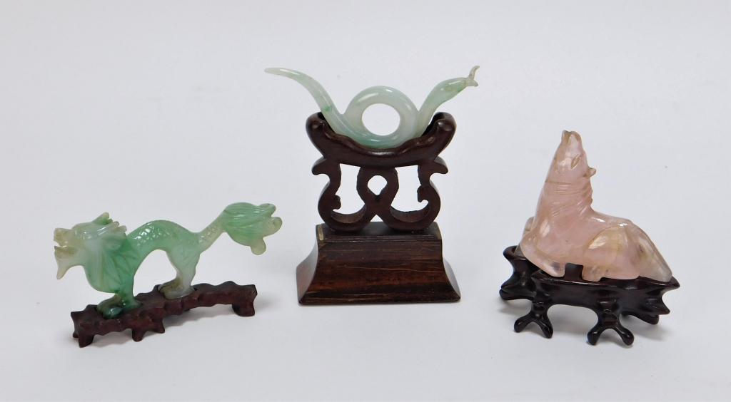 3 Chinese Qing Dynasty Carved Hardstone Group: ,China,Qing Dynasty Includes a small green figure of a Qilin, a pink hardstone carving of a horse, and a pale green hardstone figure of a snake on an ornate base. Hardstone,Smallest 1 1/4" t x 2 3/8" 