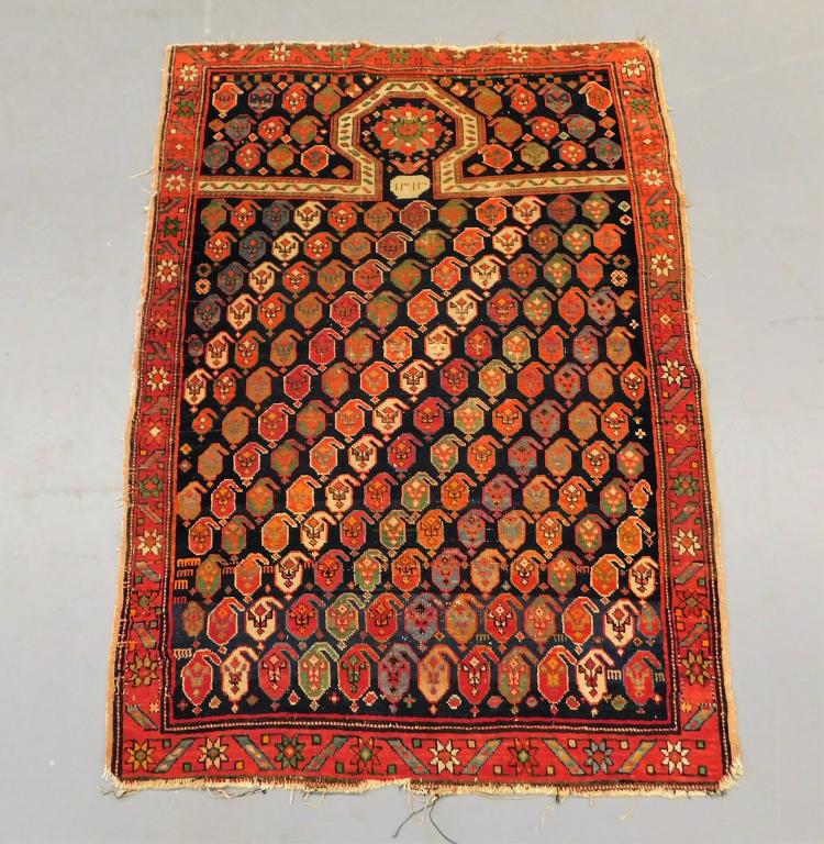 Caucasian Mirab Keyhole Prayer Rug: ,Caucuses,20th Century Repeating red, blue, green, and cream pattern over rust field surrounded by geometric boarders. Camel hair,56" x 40", Marked in Cyrillic along top. From the collection of a Camb