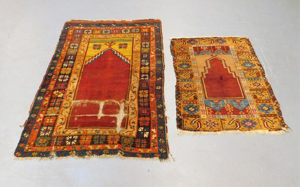 2 Turkish Geometric Prayer Rugs: ,Turkey,19-20th Century Includes two prayer rugs with red center over cream surrounded by navy, red, and cream geometric borders. Camel hair,Smallest 50" x 38",Largest 74" x 49" From the collection of