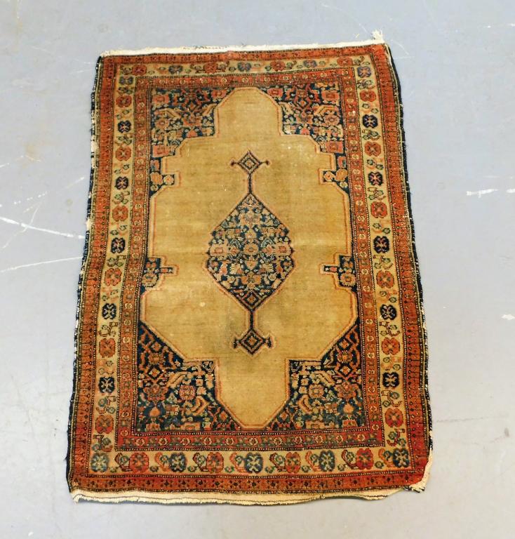 Middle Eastern Navy and Tan Botanical Rug: ,Middle East,20th Century Navy tendril medallion over tan field surrounded by floral borders. Wool,3' 4" x 2' 3", From the collection of a Providence, Rhode Island lady.