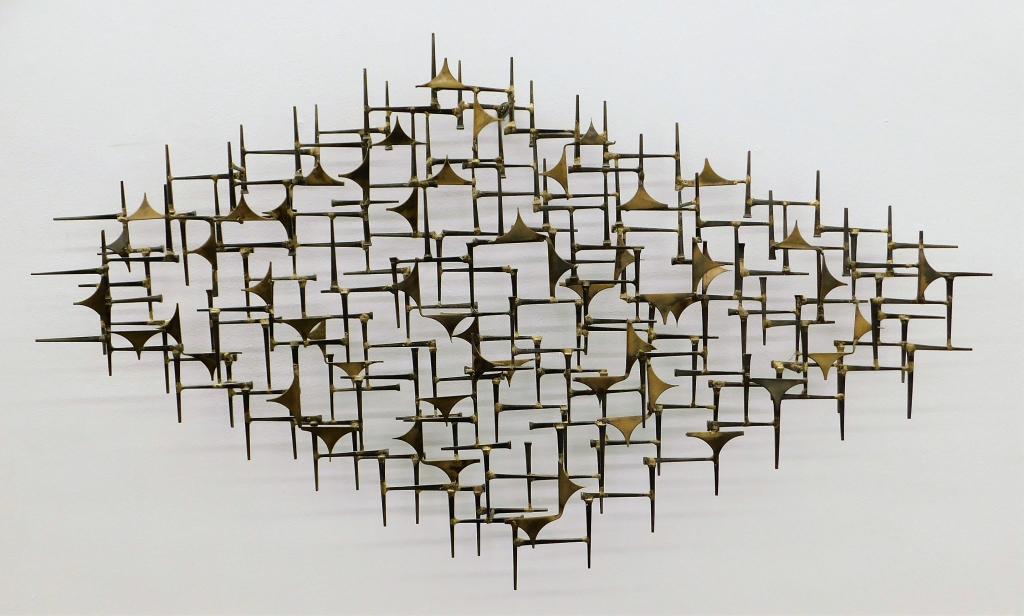Marc Weinstein Marc Creates Metal Wall Sculpture: Marc Weinstein United States,20th Century Large layered and welded assemblage of angular metal cut outs. Metal,24 1/4" t x 41" w x 4" d. From the collection of a Cranston, Rhode Island gentleman.
