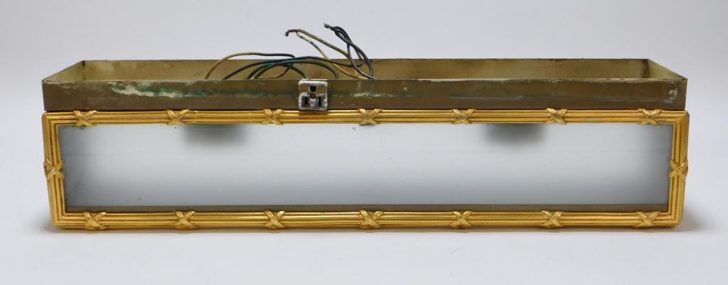 Hollywood Regency Bathroom Box Light Fixture: United States,20th Century Gilded metal frame with frosted glass shade and flip top for easy lightbulb access. Metal, glass,5 3/4" t x 23 3/8" w x 4 1/2" d. From the collection of a Medfield, Massachu