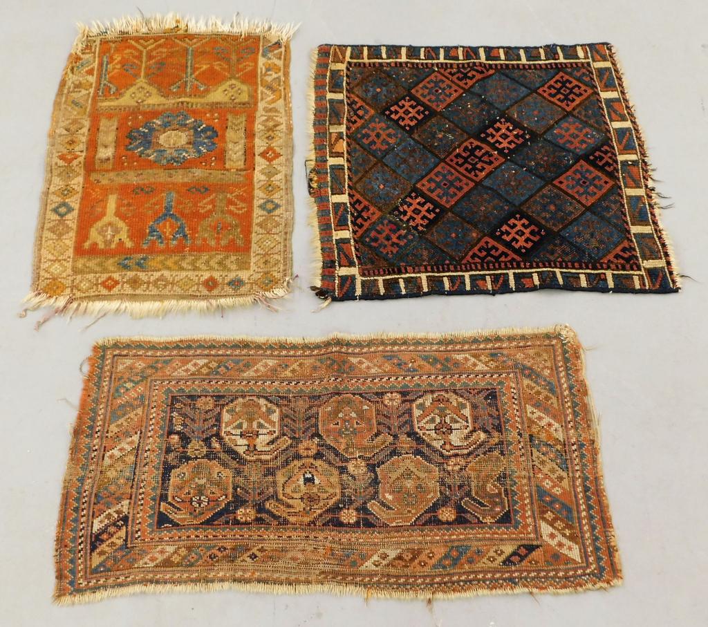 3 Small Middle Eastern Geometric Entry Carpet Rugs: Middle East,20th Century Includes a red, blue, and navy blue checkered field surrounded by geometric borders, a blue and ivory geometric field over orange field surrounded by geometric borders, and a 