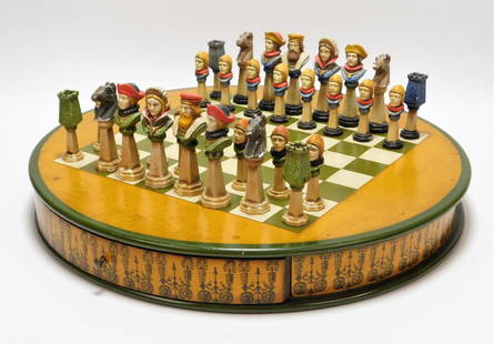 Anri Mediolanum Style Italian Figural Chess Set: ,Italy,20th Century Figural cold painted metal bust pieces of people in period dress with green and white checker board inlaid in a circular box with one drawer. Pawn 3" x 1" dia. Metal, wood,King 4 1