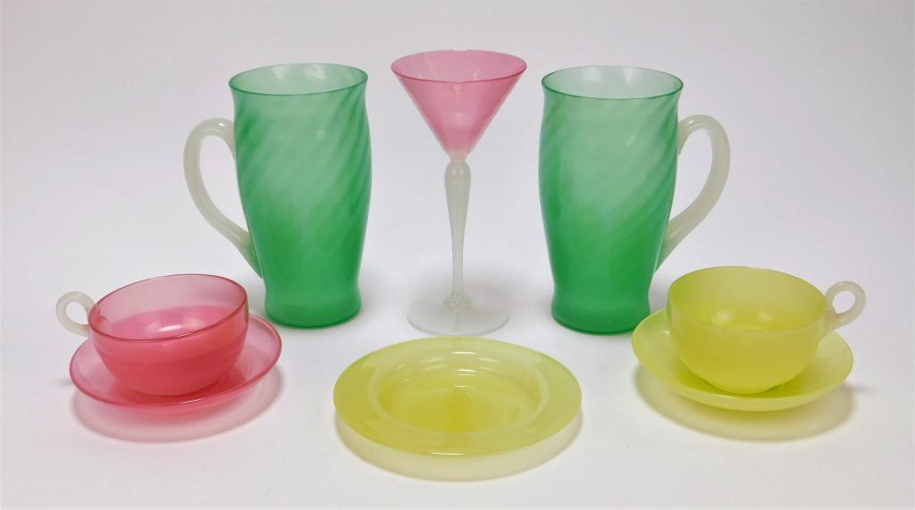 8 Steuben & Stevens & Williams Art Glass Drinkware: ,New York, England,Early 20th Century Includes a pink opaline teacup with saucer and a matching wine glass by Stevens & Williams, two jade green Steuben lemonade glasses, and a yellow opaline punch cu