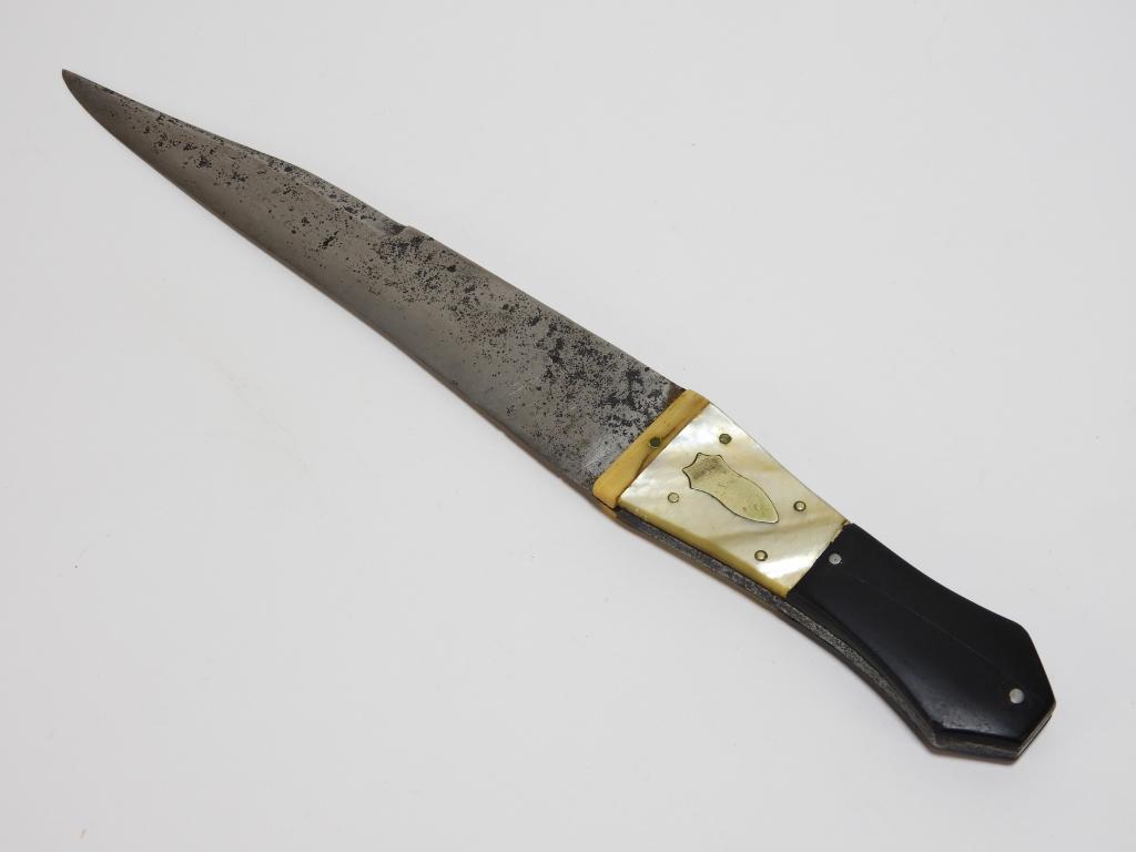 Coffin Hilt Bowie Knife: United States,C. 1840s-50s Rosewood coffin-shaped upper grip, mother of pearl lower with a German silver inlay, and a steel blade with a clipped point.Blade lg. 8 1/4".Overall lg. 12 3/4"From the coll