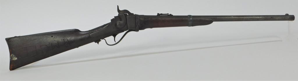 Sharps New Model 1863 Carbine: ,C. 1863-65 .52 caliber, serial number 39187, walnut stock with "R. MGEE" carved on the right side of the butt, steel fittings, with carbine sling bar on the left side. Barrel lg. 22'.Overall lg. 39"
