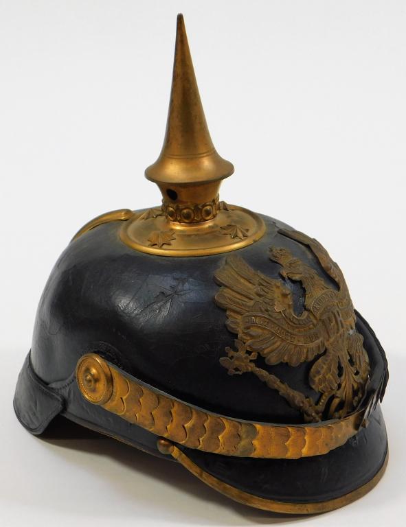 German Model 1895 Infantry Officers Pickelhaube: Germany,C. 1895-1915 Black japanned leather helmet shell, brass spike and fittings, Prussian eagle on the front, brass scales over leather chinstrap, leather sweatband with a silk liner. Overall ht. 9