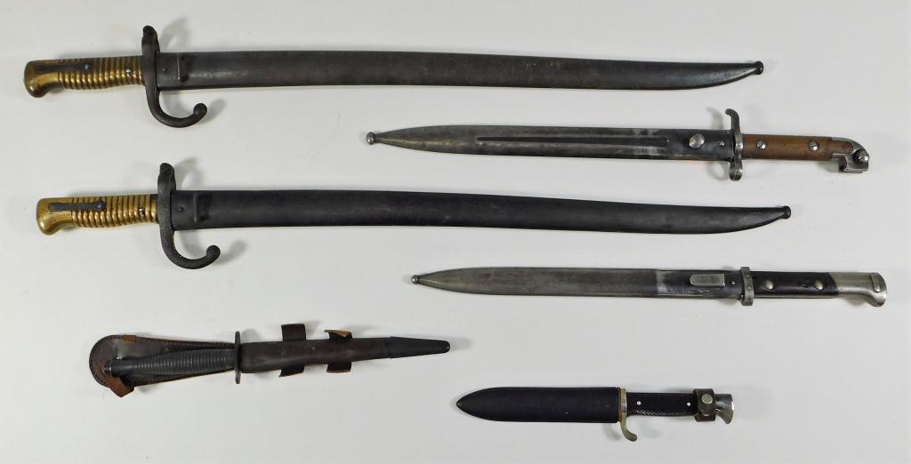 Group of Six Edged Weapons: ,C. 19th and 20th century Two French Model 1866 Chassepot Bayonets and scabbards, a Fairbairn-Sykes Fighting Knife and sheath with "ENGLAND" stamped on the guard, a German scout knife and scabbard, a 