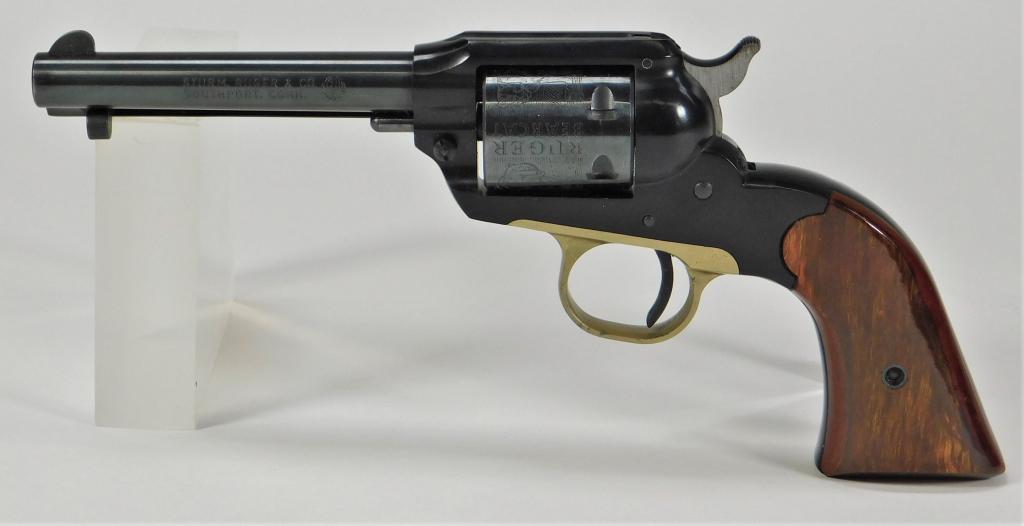 Ruger Bearcat Revolver: United States,C. 1972 .22 LR caliber, walnut grips, brass trigger guard, blued finish, engraved cylinder marked "RUGER/BEARCAT," and marked on the left side of the barrel "STURM RUGER & CO./SOUTHPORT,