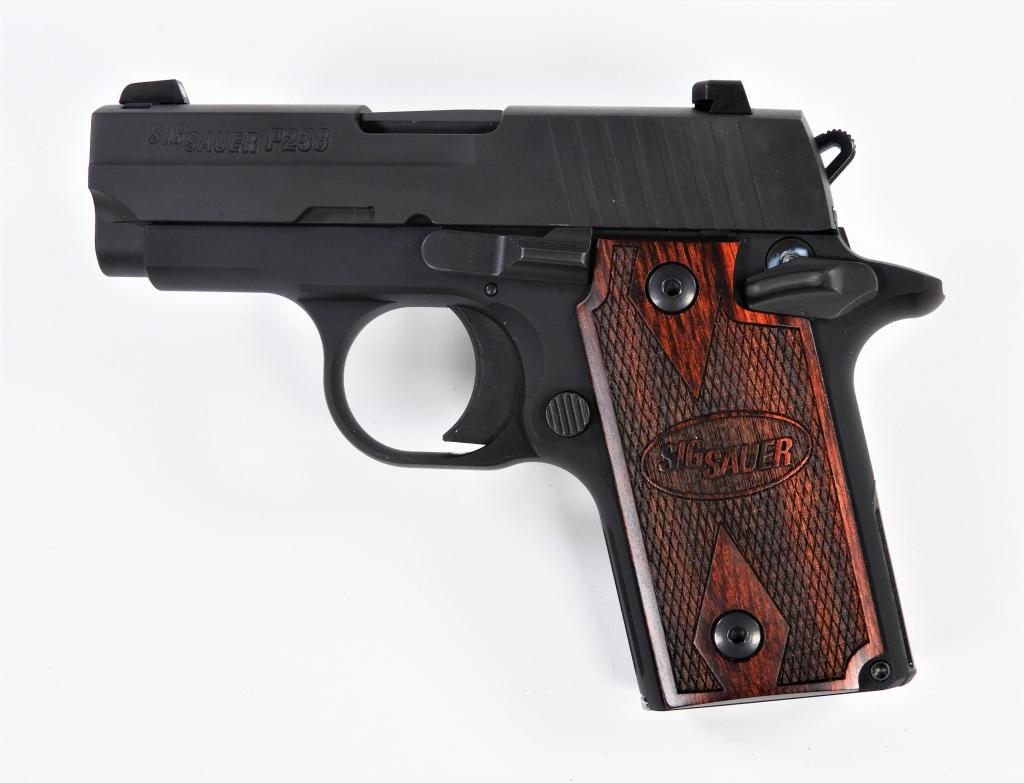Sig Sauer Model P238 Semi-automatic Pistol: ,C. 2012 .380 caliber, serial number 27A185162, checkered rosewood grips, black frame and slide, marked on the left of the slide "SIG SAUER P238," with a magazine, plastic holster, lube, trigger lock,