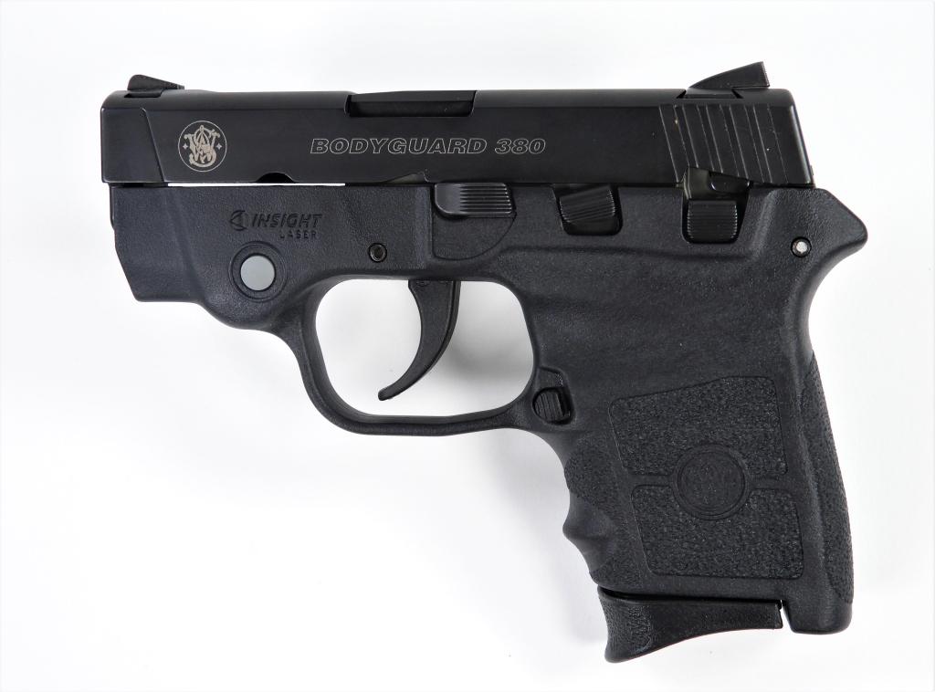 Smith & Wesson Bodyguard Semi-automatic Pistol: United States,C. 2011 .380 caliber, serial number EAP4392, plastic grip and frame with laser sight, black finished slide marked on the left side "BODYGUARD 380," with padded carry case, magazine, lock