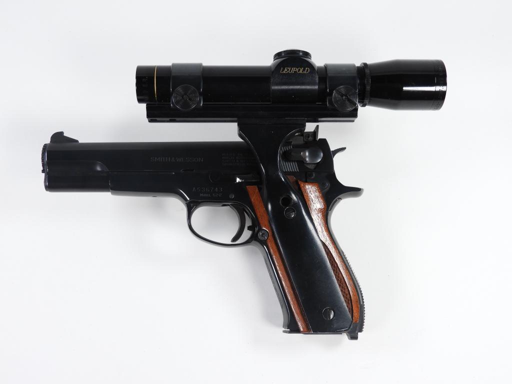 Smith & Wesson Model 52-2 Semi-automatic Pistol: United States, .38 special, serial number A536743, checkered walnut grips, black finish, marked on the left side of the slide "SMITH & WESSON," with a Leupold M8-2X scope. Note: FFL