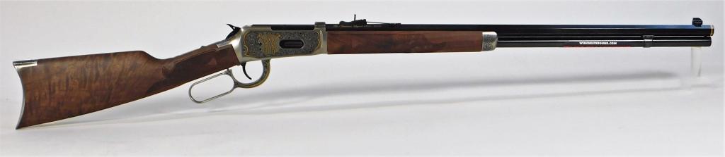 Winchester Model 1894 Lever-action Rifle: Japan, .30-30 caliber, serial number M942016191, 150th commemorative rifle, walnut stock with checkered wrist and forend, engraved stainless fittings, receiver engraved with foliate designs and gold i