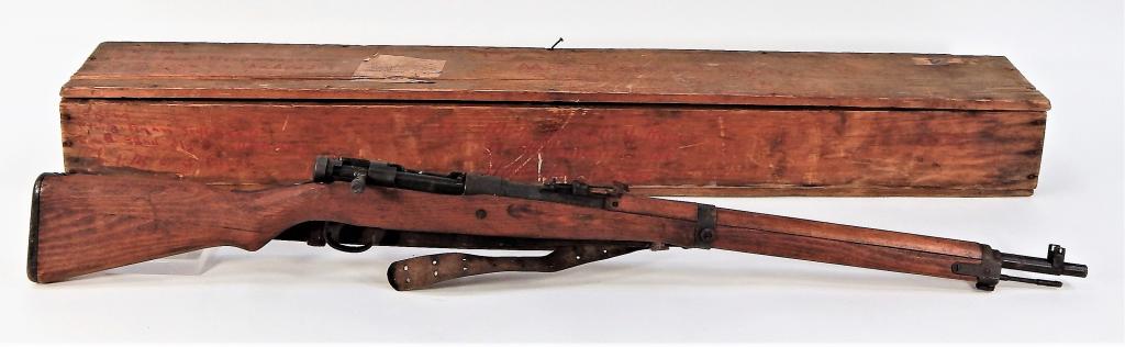 Japanese Type 99 Arisaka Short Rifle and Crate: Japan,C. 1939-45 7.7 x 58mm caliber, serial number 73210, walnut stock, blued steel fittings, chrysanthemum intact on the receiver ring, cleaning rod, a leather U.S. sling, and the crate it was shippe