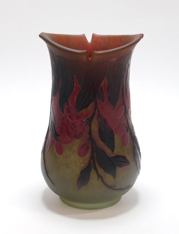Daum Nancy Cameo Glass Vase: France,Early 20th Century Bud shaped vase with notched rim decorated with oxblood leaf and branch patterns over green and red. Glass,8 5/8" x 5 1/8" dia., Marked "Daum Nancy" on side of body, initiale