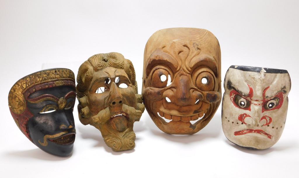 4PC Japanese Noh & Central American Carved Masks: Japan, Central America,20th century Includes a large Noh mask with wide round eyes, flared nostrils, and large teeth, a Noh mask painted white with red makeup, a black painted mask with red and gilded