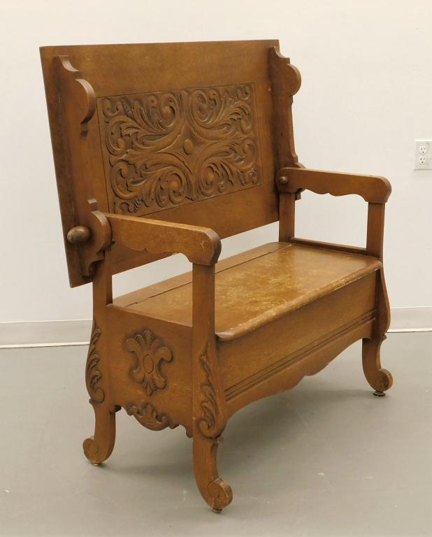 MIdwestern Oak Carved Flip Top Table Bench: United States,Circa 1890 Ornately carved backrest folds into a rectangular table top over flip top bench opening up to a single compartment decorated with acanthus leaves and curved feet. Wood,When sh