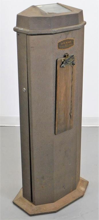 Dow Jones Wall Street Journal Ticker Tape Machine: United States,Mid 20th Century Angular metal body with with glass panel top, original clipboard, and key. Metal, glass,Approx. 49" t x 18" w x 14" d. From the collection of an East Greenwich, Rhode Is